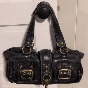 This is a limited edition Coach Legacy 65th Anniversary Mandy satchel in black